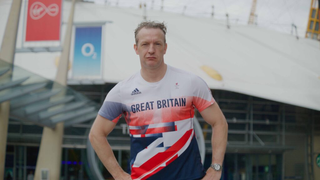 Athlete in Great Britain Adidas kit outside O2 Arena