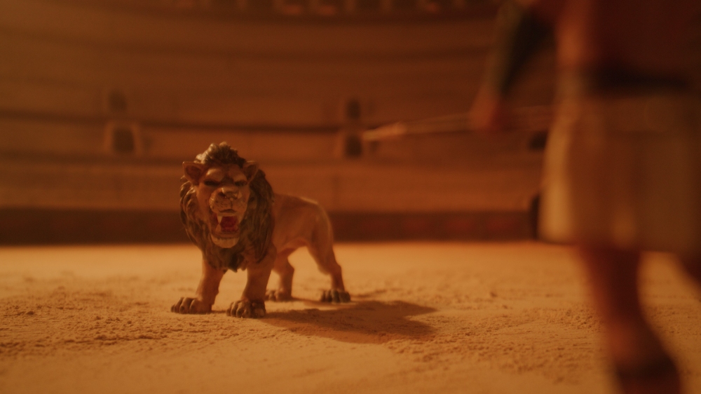 Roaring Colosseum Lion Snarling lion in a dusty Roman colosseum arena