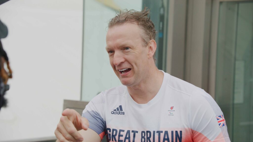 Great Britain Athlete Interview Man in Great Britain Adidas jersey speaking outdoors