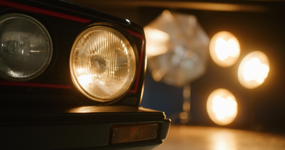 Classic Car Headlight Classic car headlight close-up in dramatic studio spotlight