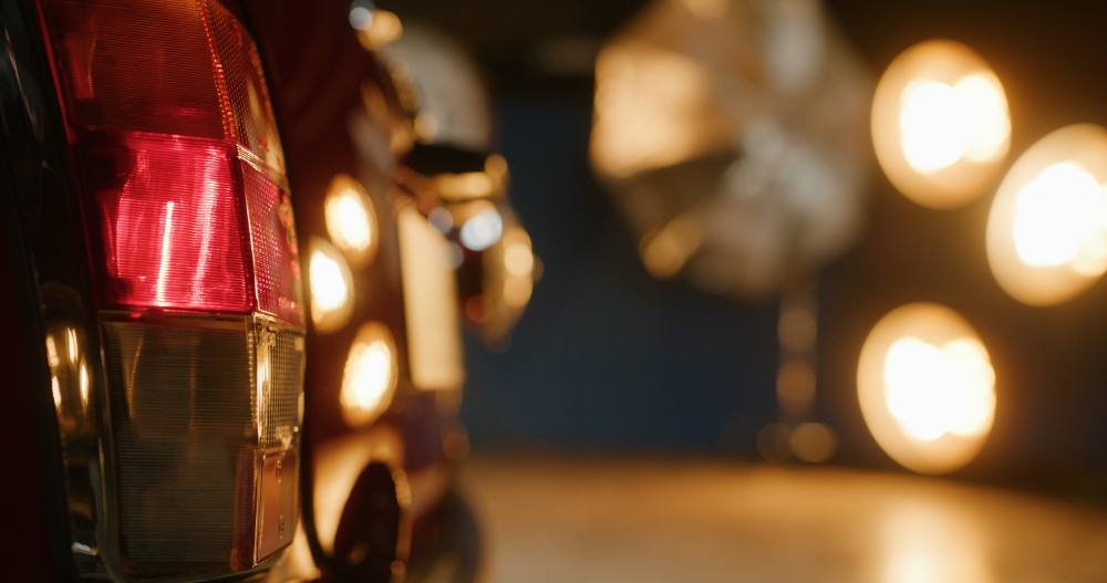 Car Tail Light Detail Close-up of red car tail light under warm studio lighting