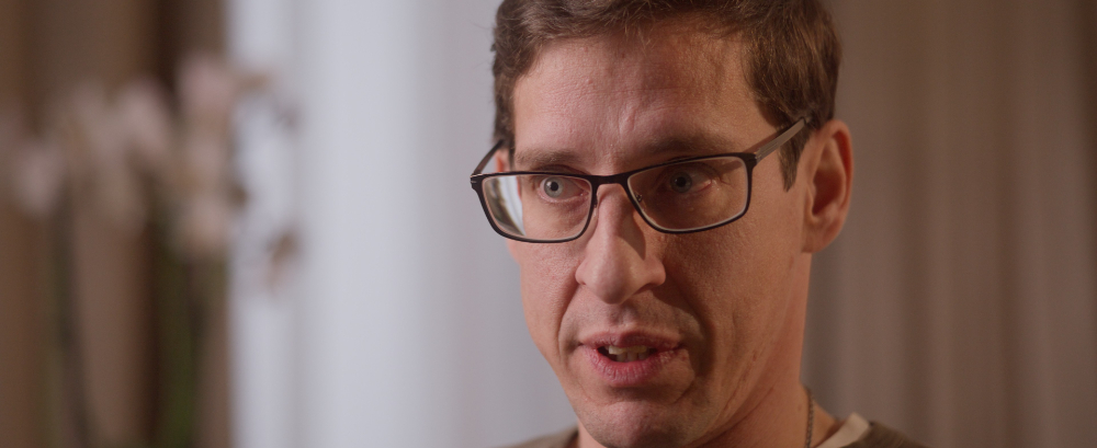 Man with glasses speaking in Kedrion Factor X interview