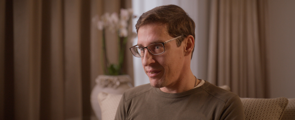 Man in glasses featured in Kedrion Factor X German case study