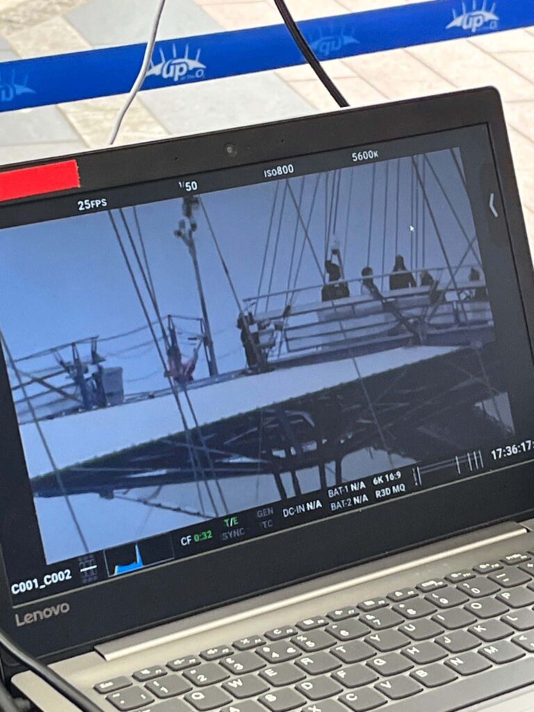 On-Set Monitor Playback Lenovo laptop monitor showing black and white film footage on set