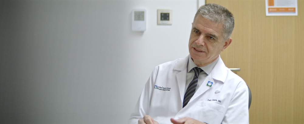 TEUR Doctor Interview Doctor in white coat speaking in a hospital corridor