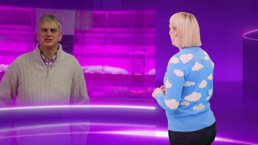 Virtual Studio Presenters Two presenters talking on a purple virtual TV studio set