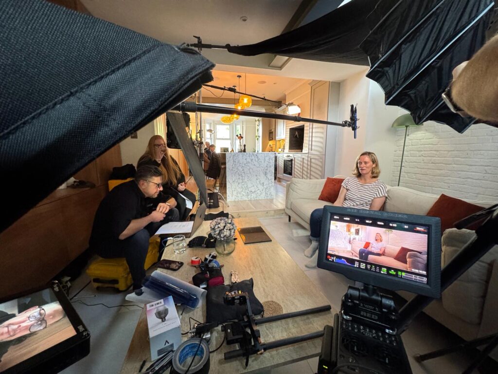 Sofa Interview Setup Camera pointed at woman being interviewed on a sofa