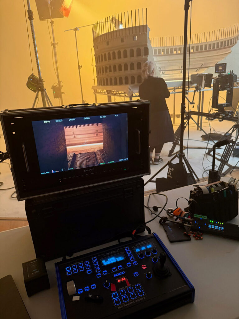 Miniature Set Filming Camera monitor and control panel filming inside a miniature Colosseum set