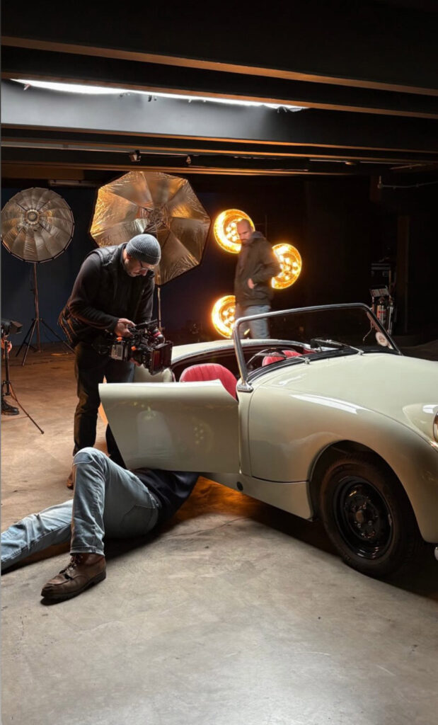 Classic Car Shoot Photographer filming interior of a classic vintage car in studio