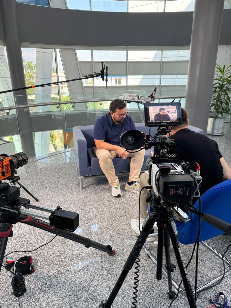 Interview Recording Setup Two-camera interview recording being set up in modern office space