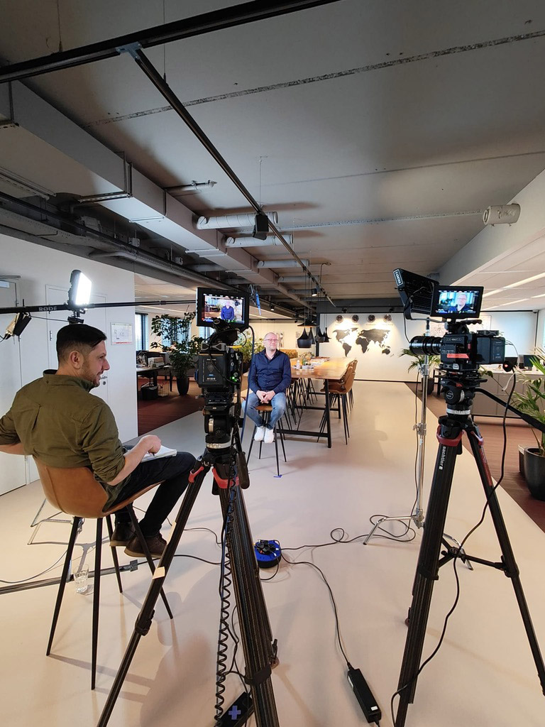 Multi-Camera Interview Setup Multiple cameras on tripods set up for an interview in studio