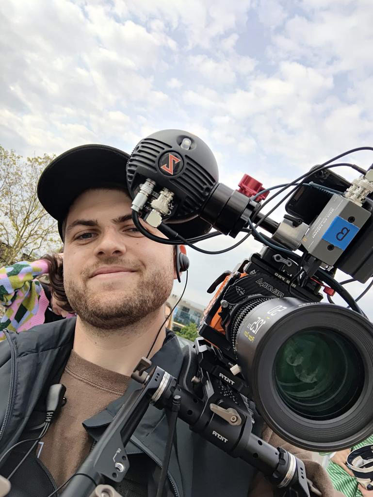 Cameraman with Film Camera Cameraman selfie holding a large professional film camera